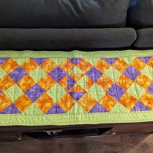 Double sided Quilted table runner. Vibrant colors.